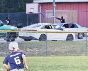 Friday At Wrigglesworth This is another still image of subject shooting toy gun from vehicle on Harris Street during youth baseball game Friday at Wrigglesworth Sports Complex.
