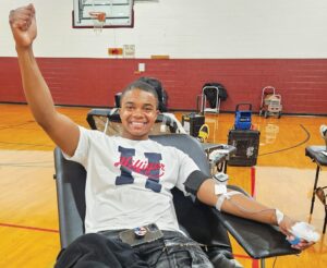 UPPER RIGHT: Tyrone Robinson was happy to give.