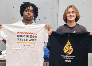 LOWER LEFT: Braylon Fuller and Sam Harris display event tee-shirts.