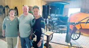 Galloping Back Into History DAR and Colonial Dames members recently enjoyed a tour of the Robert Thomas Carriage Museum in Blackstone. Shelia Amos (left) and Lucy