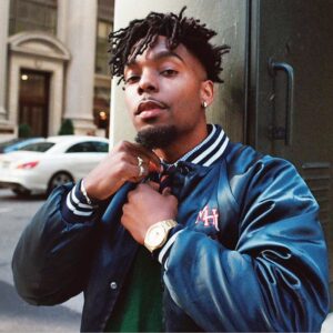 Matthew Alexander Bagley (right), who performs as “Alexander Mac,” has been nominated for a Grammy for an album he produced, “Words for Days, Vol. 1” (album cover at left).