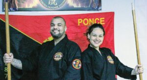 ‘We’ Over ‘Me’ Kevin & Maritza Pereira (above) are offering free Jujutsu classes to a wide variety of area residents. Among those “getting a kick” out of learning is Thomas Gee (far right), son of Kyle & Kathy DeBusk Gee of Blackstone.